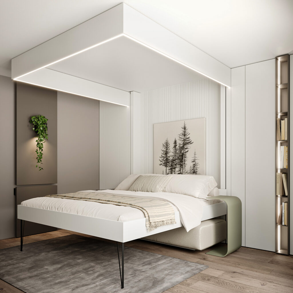 Lit escamotable deux places déployé au sol avec un tableau au mur derrière et une bibliothèque à droite.